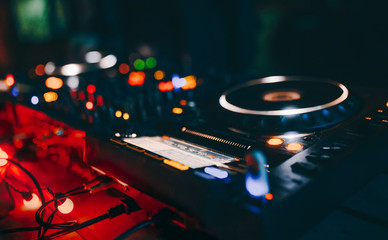 Professional techno rave minimal urban light concert dj turntables player PIONEER device with sound...