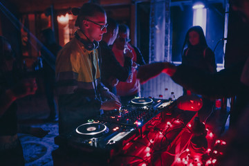 Chisinau, Moldova 11.10.2019. Rave techno DJ plays concert set with CD player turn table & Pioneer...