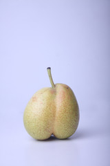 concept of ugly food - pear on light background