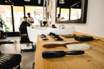 Vintage barber shop tools on wood with place for text