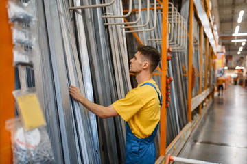 Fototapeta premium Constructor choosing materials in hardware store