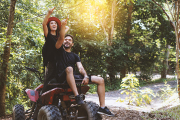 Adventure to the jungle on ATV with lover, best friend concept © PANYA