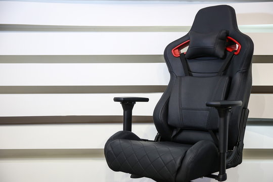 computer gaming chair on a striped background with copy space