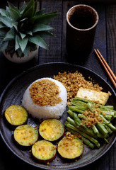 plate of rice dish for lunch meal, vegan homemade Vietnamese eating