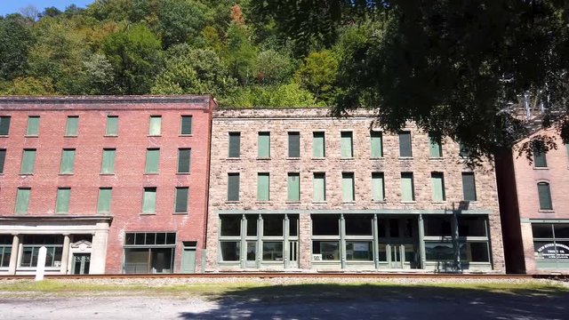 Trucking shot of abandoned railroad coal town of Thurmond, West Virginia run by the US National Park Service.