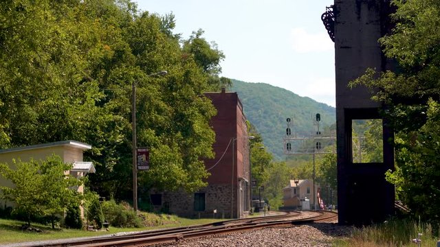 Establishing shot of coaling tower, railroad station and abandoned town of Thurmond in West Virginia, owned and operated by the US National Park Service.