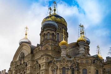 Fototapeta na wymiar The orthodox Church of the Dormition of the Mother of God stands towering on the Vasilievsky Island in Saint Petersburg, Russia