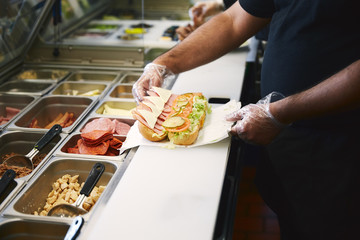 cook making sandwich on the restaurant kitchen 