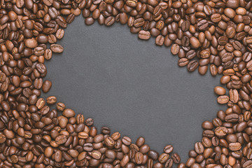 Roasted coffee beans frame background on black with copy space