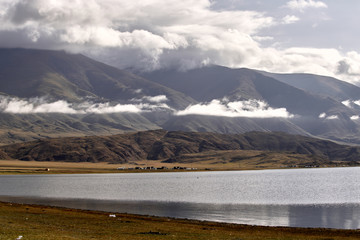 Lake Tolbo Nuur, Mongolia. Mountains and yurts near the lake