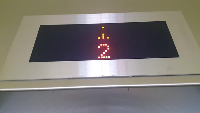 Digital display counter for a modern elevator with red lights 