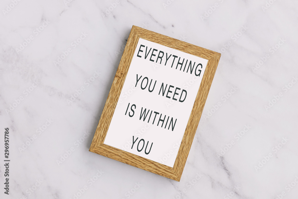 Wall mural everything you need is within you - inspiration quotes on wooden frame.