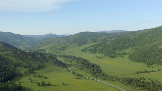 moving forward to pine woods and mountain valley in summer day. Europe outdoor green nature scape mountains wild aerial establisher.4k drone flight establishing shot