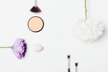 Stylish flat lay frame of makeup products