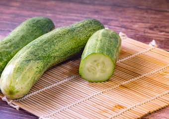 Fresh cucumber fruits on a wooden table