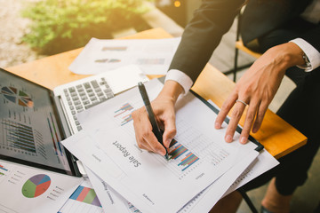 Business woman working with graph data at office,Finance managers task,Concept business and finance