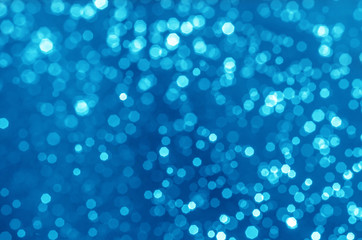 abstract blue bokeh glitter sparkle background.