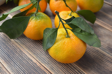 Tangerines on a wooden background