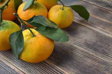 Tangerines on a wooden background