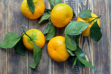 Tangerines on a wooden background