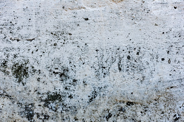Texture of a concrete wall with cracks and scratches which can be used as a background