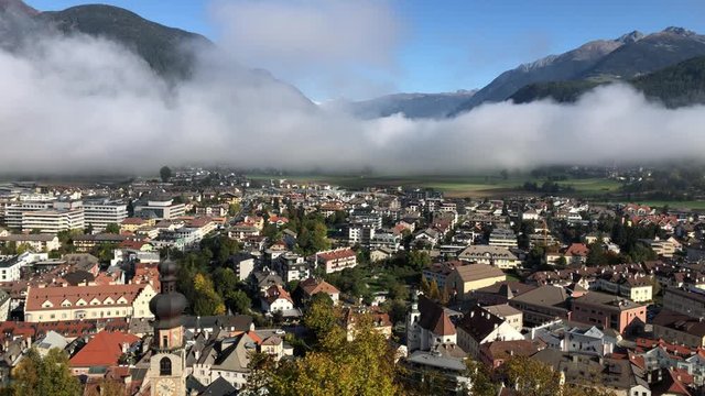 Panoramic view of the city Brunico - Bruneck with the clouds above in the Puster Valley, South Tyrol, Italy