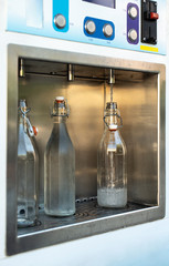 Mineral Water machine on the street. Pay and load drinking water.