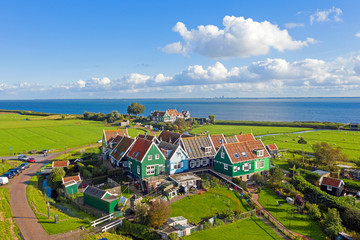 Aerial from the traditional village Marken at the IJsselmeer in the Netherlands - obrazy, fototapety, plakaty