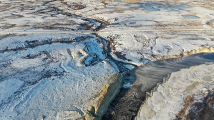 Winter Landscape of the forest-tundra, river bank, bird's eye view.Arctic Circle, tundra. Beautiful landscape of tundra from a helicopter.