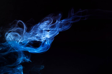 Incense smoke spiral colors on black background