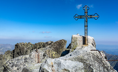 Cross on the highest peak (Gerlachov Peak, Gerlachovsky stit, Gerlach) of the Tatra Mountains. Mountain guides often lead their clients here.