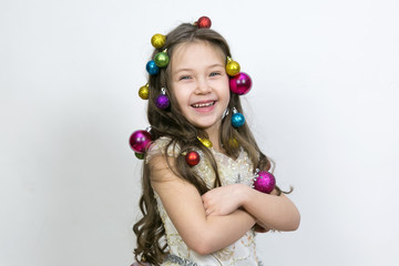 The joy of the child from the New Year holidays. The girl experiences happiness from the coming Christmas.