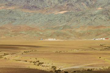 Fototapeta na wymiar Yurts on a background of mountains, Mongolia