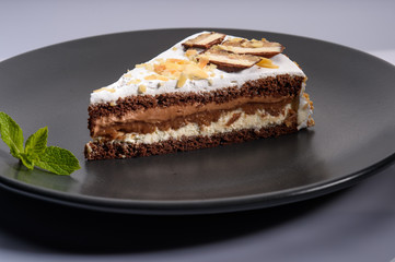 delicious cake with chocolate cream on a black plate9
