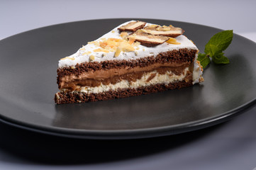 delicious cake with chocolate cream on a black plate8