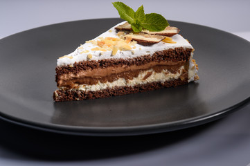 delicious cake with chocolate cream on a black plate6