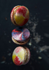 colorful macaroons on dark background