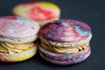 colorful macaroons on dark background