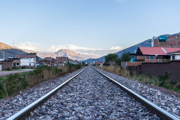 Fototapeta na wymiar train tracks with distant mountains
