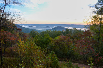 View of the fog covered valley below. Taken from the top of Morrow Mountain State Part NC