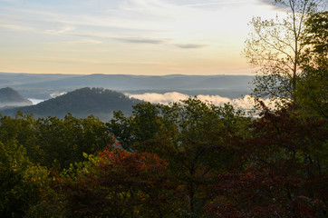 View of the fog covered valley below. Taken from the top of Morrow Mountain State Part NC