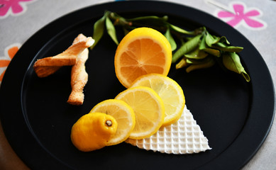 lemon and baking on a black plate