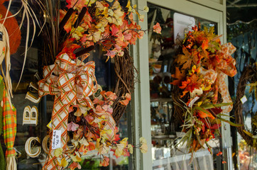Fall and Halloween decorations at a store front in Southport North Carolina.