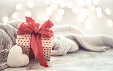 Background holiday, gift in a beautiful box with a heart . - obrazy, fototapety, plakaty