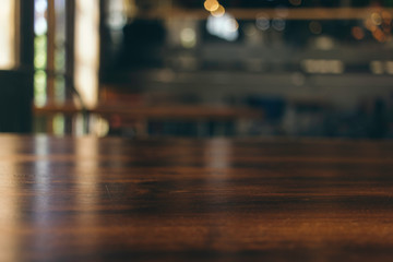 wooden table in front of abstract blurred background