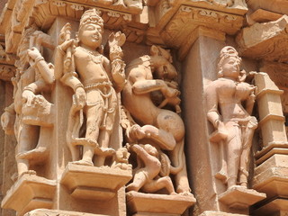 Sex poses from the kamasutra, erotic close - up of intricate carved scenes on the walls of Hindu temples in the Western group of Khajuraho, India