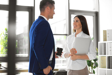 Portrait of business trainers in office wear at workplace