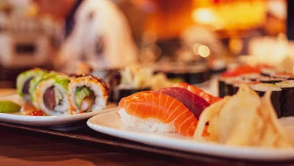 Zelfklevend Fotobehang sushi on a plate in a sushi restaurant © ontronix