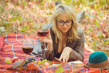 Autumn golden time, portrait of woman with a glass of wine at nature outdoors 