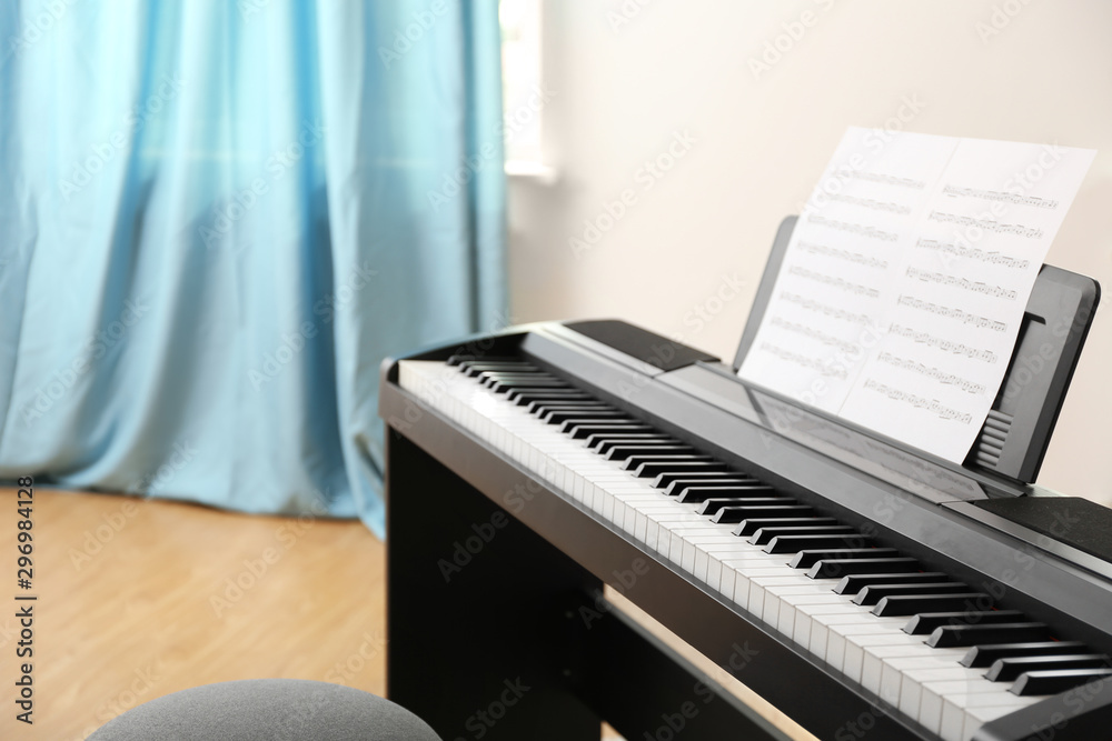 Poster Modern piano with music sheets in room